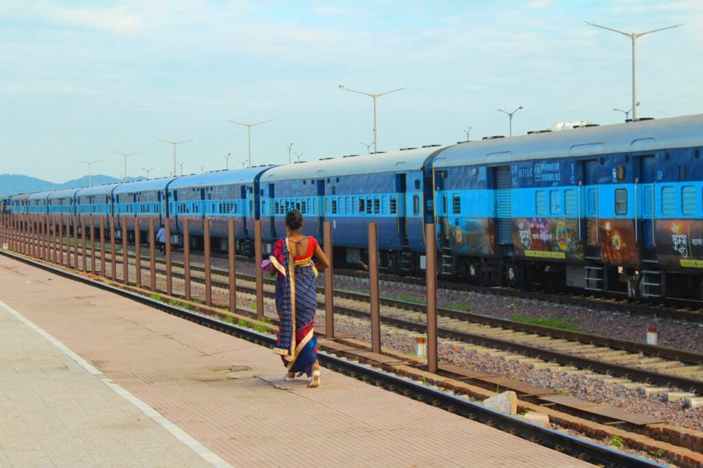 women walking at a railway station